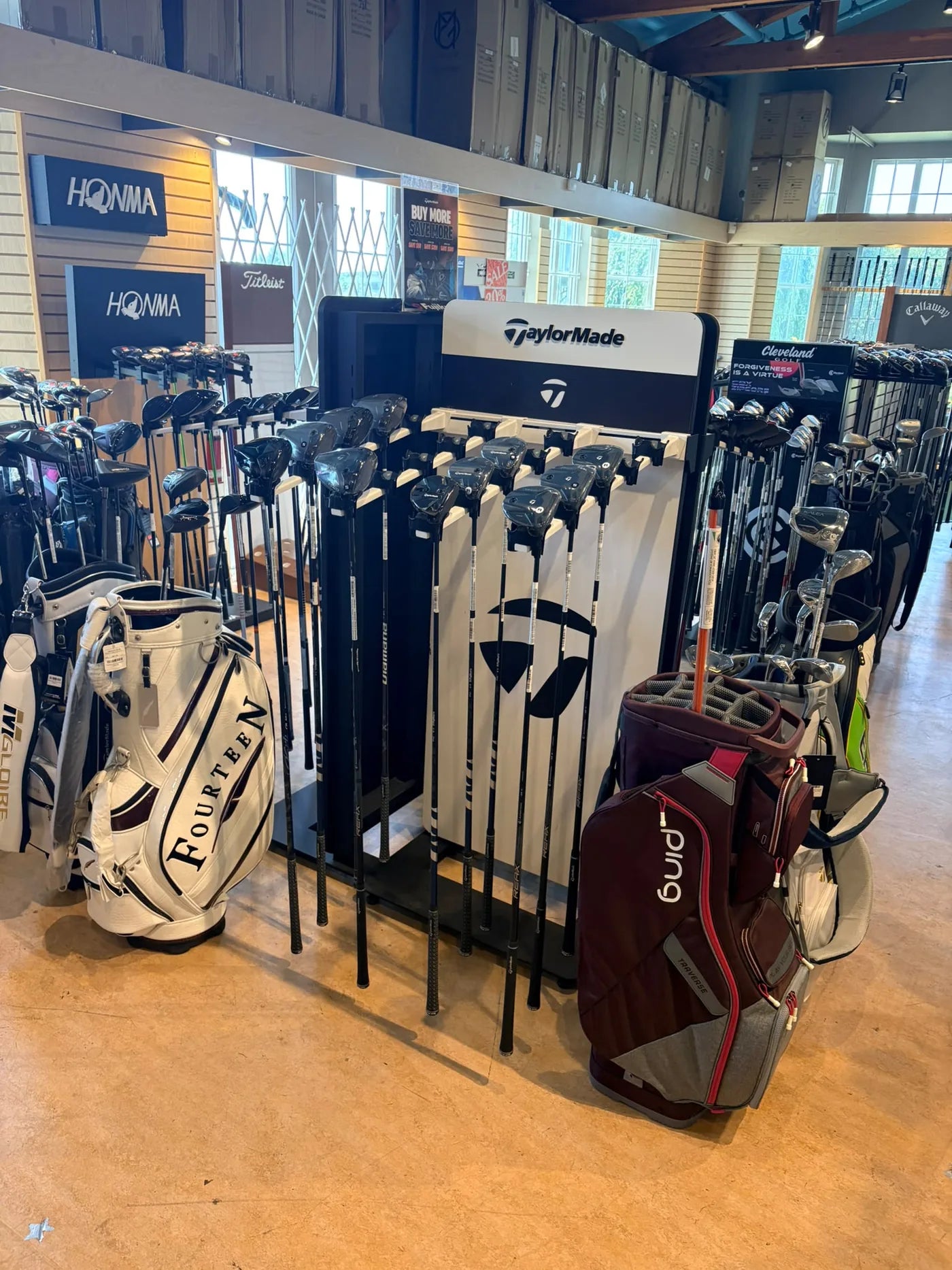 Golf clubs and bags inside the ReGolf Surrey pro shop